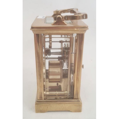 1073 - Brass and glass five-sided carriage clock with Roman numerals, bracket feet