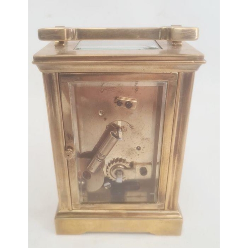 1073 - Brass and glass five-sided carriage clock with Roman numerals, bracket feet