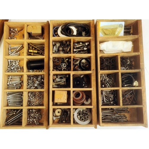 1074 - Oak jewel cabinet with two doors enclosing shelves and contents of assorted nuts, bolts, drill bits,... 