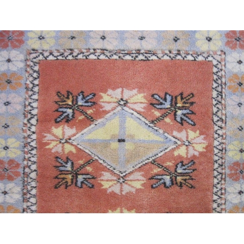 1102 - Oriental carpet manufacturer's wool rug in yellow, orange and blues, 216cm x 124cm