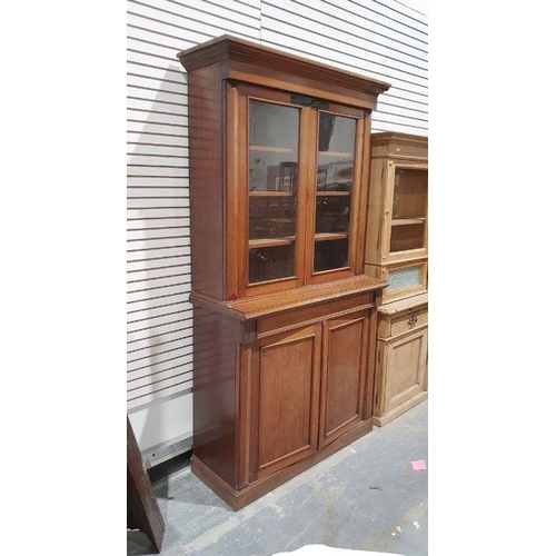 1200 - Late 19th century mahogany bookcase cabinet, the moulded cornice above two glazed doors enclosing sh... 