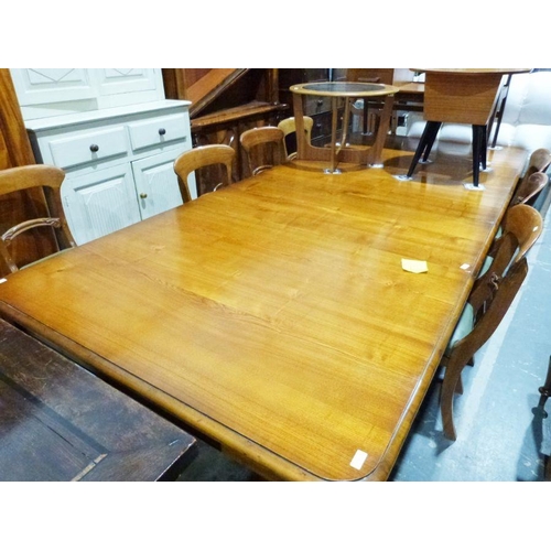 1208 - Large 20th century extending dining table, the rectangular top with rounded corners, on turned suppo... 