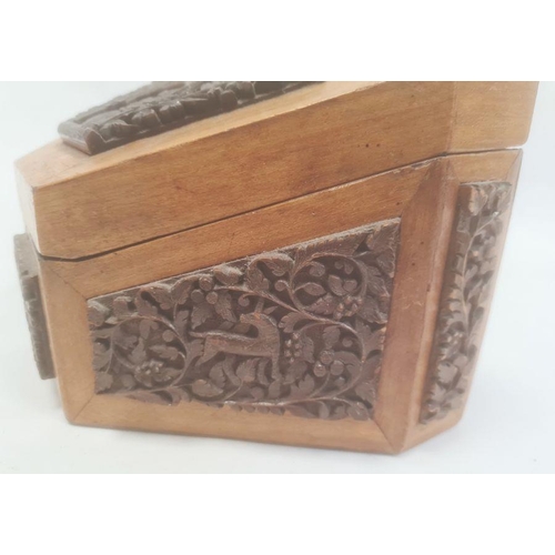 123 - Carved stationery box, the hinged cover and sides with applied carved panels, possibly Indian, depic... 