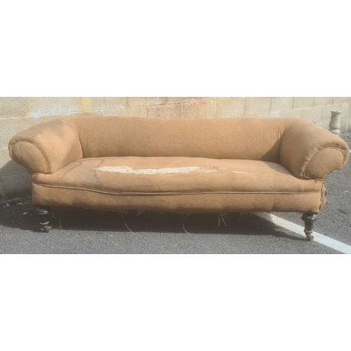 1415 - In the manner of Howard & Sons of London three-seat Chesterfield sofa on turned legs, brass Howard-t... 