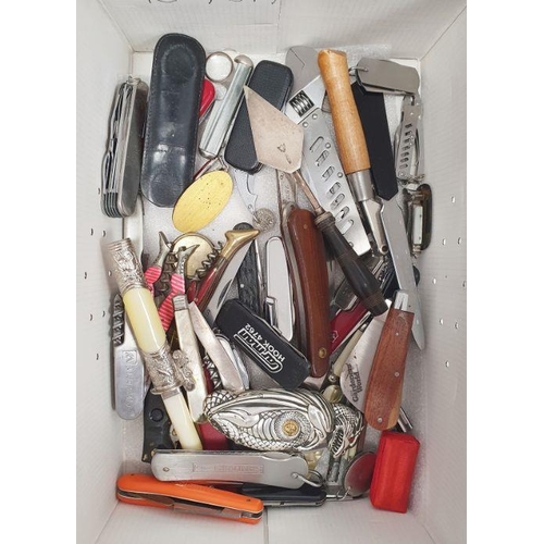 176 - Quantity of penknives including a silver example, corkscrews, tools and other folding utensils