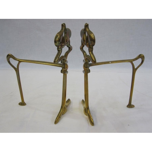 272 - Pair of Art Nouveau brass firedogs with silver-coloured screws, 23.5cm high (2)