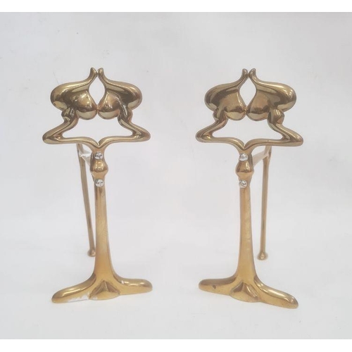 272 - Pair of Art Nouveau brass firedogs with silver-coloured screws, 23.5cm high (2)