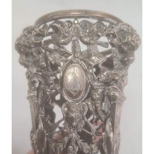 399 - 19th century silver-coloured metal trumpet-shaped vase holder, elaborately decorated, pierced with r... 