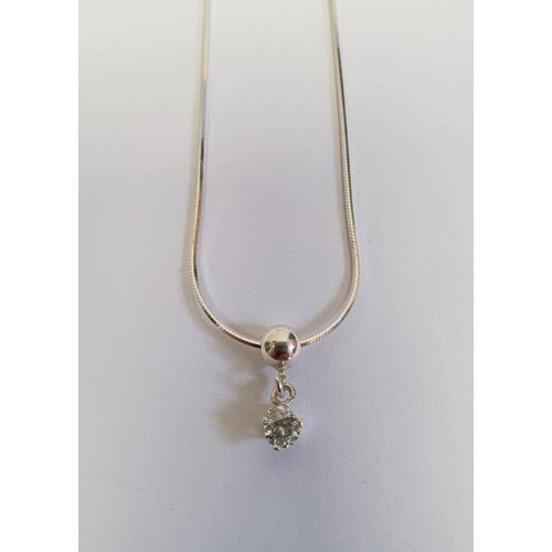 410 - Solitaire diamond drop pendant, claw-set in silver mount, on fine chain, the stone approx 0.10ct