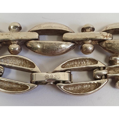 420 - Silver bracelet of multiple interlocking links, another silver-coloured bracelet of oval and bar lin... 