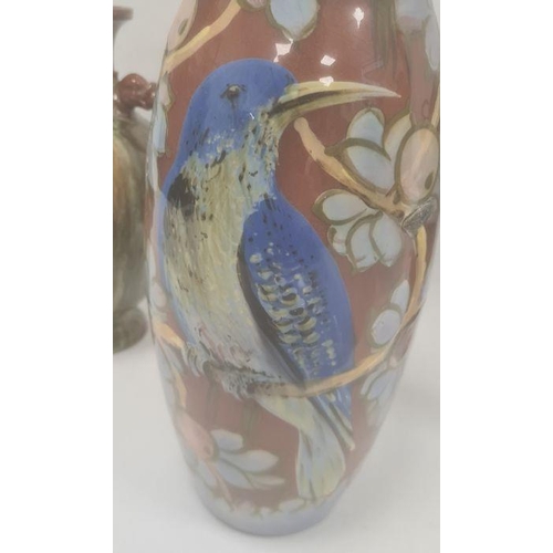 46 - Torquay pottery vase decorated with a bird perched on fruiting branches, 32cm high (large chip to ba... 