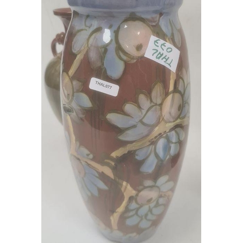 46 - Torquay pottery vase decorated with a bird perched on fruiting branches, 32cm high (large chip to ba... 