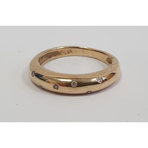 490 - Gold ring set with seven small diamonds in rubover setting, marked 585, finger size P1/2, approx. we... 