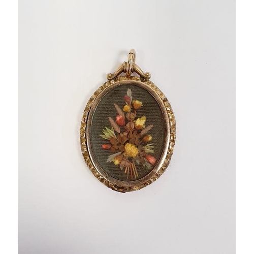 504 - 9ct gold double glass locket, oval with scroll surmount, chased sides inset with small pressed flowe... 