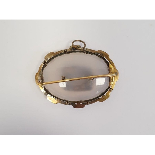 505 - Victorian moonstone and gold-coloured metal mourning brooch, the oval stone bevelled and set with ce... 