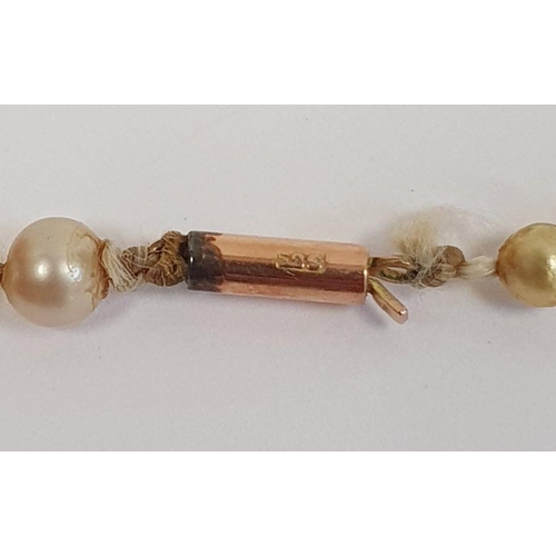 512 - Double strand of large baroque type pearls on white metal paste set clasp and a graduating string of... 