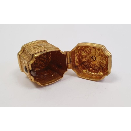 520 - A 19th century gilt metal etui, tapering octagonal shaped, relief decorated with flowers and figures... 