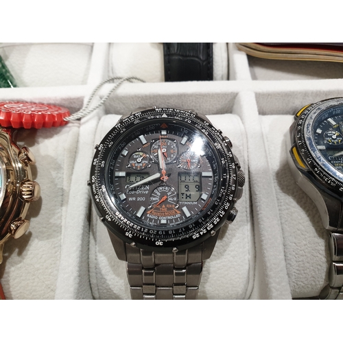 596a - Four watches in case; including Citizen eco-drive, and Constantin Weisz watch etc