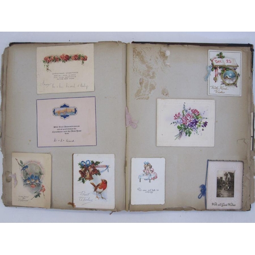 127A - Early 20th century scrapbook containing greetings seasons cards, postcards