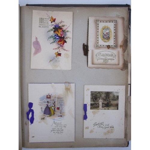 127A - Early 20th century scrapbook containing greetings seasons cards, postcards