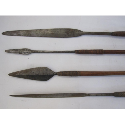 15 - Four assorted spears with wooden handles (4)