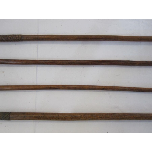 15 - Four assorted spears with wooden handles (4)