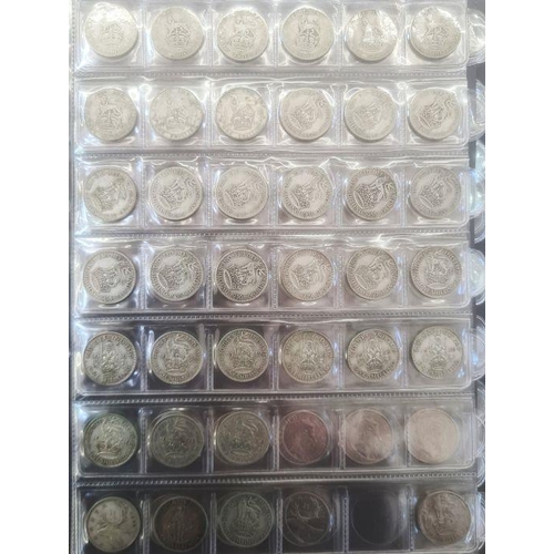 153 - Two albums of coins including silver shillings, sixpences, together with commemoratives