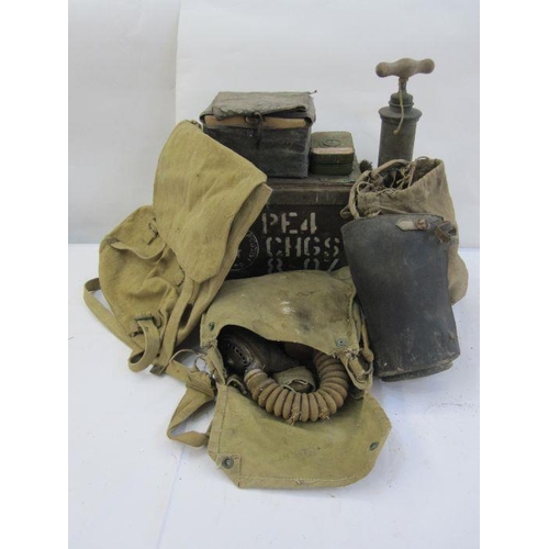 17 - Three WWII gas masks, an ammunition box, a pump, a rucksack, two metal boxes of film cartridges, a p... 