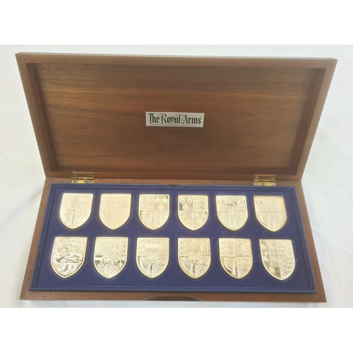 217 - The Silver Collection of the Royal Arms 12 hallmarked shields, 581g, on box of issue and 12 informat... 