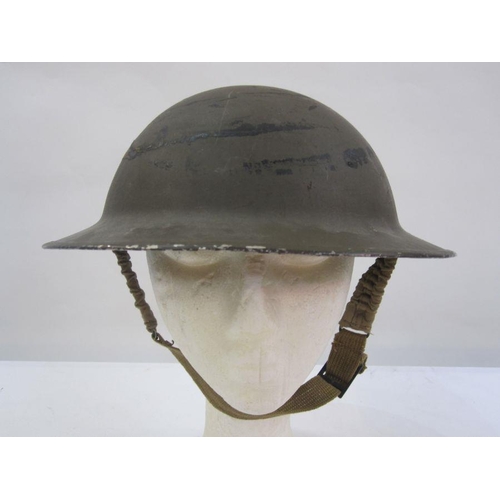 24 - WWII Home Guard helmet with red material manufactured in Stroud factory for the Royal Guards uniform... 