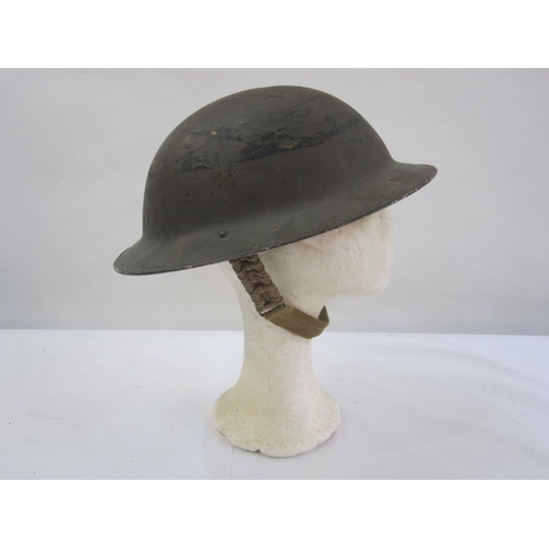 24 - WWII Home Guard helmet with red material manufactured in Stroud factory for the Royal Guards uniform... 