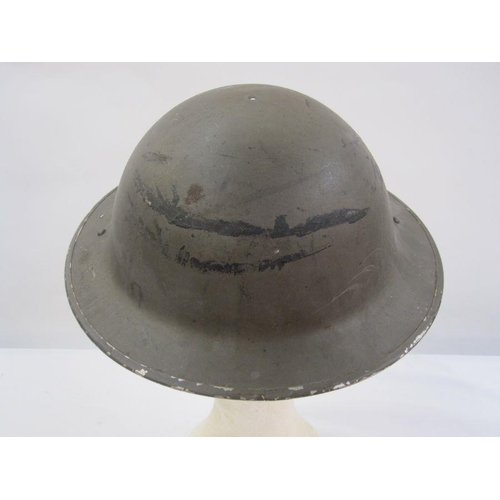 24 - WWII Home Guard helmet with red material manufactured in Stroud factory for the Royal Guards uniform... 