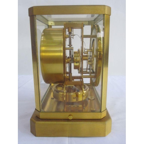 85 - Atmos Jaeger-Le-Coultre clock in brass and glazed case, serial no. 75177, with customers instruction... 