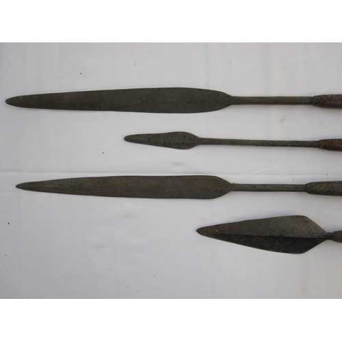 15 - Four assorted spears with wooden handles (4)