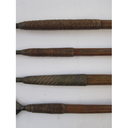 15 - Four assorted spears with wooden handles (4)