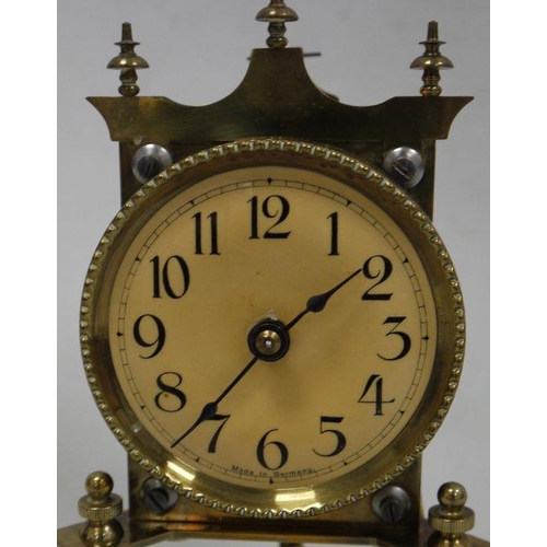 1059 - German dome-cased brass mantel clock with Arabic numerals to the dial