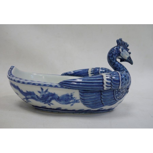 107 - Underglaze blue decorated Asian dish in the form of a rooster, 21cm wide