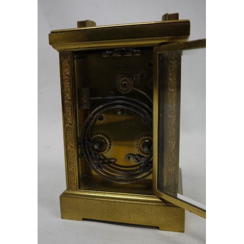 1083 - Late 19th century glass and brass carriage clock with Arabic numerals to the dial, marked 'Hamilton ... 