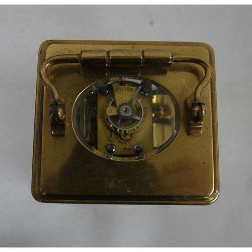 1085 - Brass and glass carriage clock with Roman numerals to the dial, in leather carry case