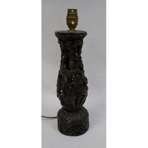 112 - Eastern carved and pierced hardwood table lamp with figure of a dancer accompanied by a fawn, 29cm h... 