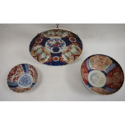 119 - Imari porcelain plaque, circular and ribbed, 52cm diameter, an Imari porcelain bowl, fluted and with... 