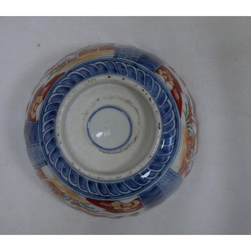 119 - Imari porcelain plaque, circular and ribbed, 52cm diameter, an Imari porcelain bowl, fluted and with... 