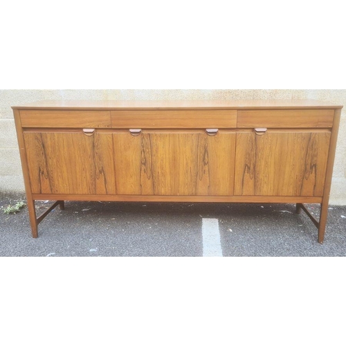 1311 - Nathan teak Caspian range sideboard, the rectangular top above three drawers, two cupboard doors and... 