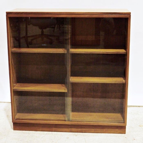 1312 - Mid-century modern teak bookcase with shaped sliding glass doors enclosing adjustable shelving, on p... 