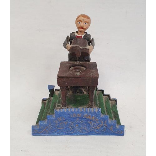 146 - Reproduction cast iron money bank, painted 'Magician Bank', with magician standing at table with hat... 