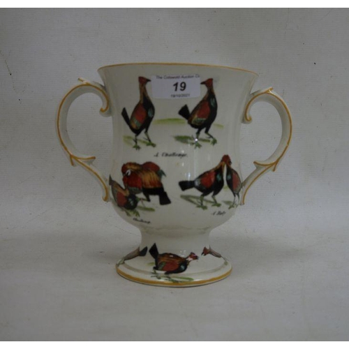 19 - Ceramic two-handled trophy cup decorated with fighting birds 'A Challenge', 'A Knock Down Blow', etc... 