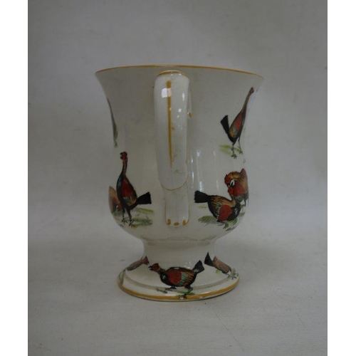 19 - Ceramic two-handled trophy cup decorated with fighting birds 'A Challenge', 'A Knock Down Blow', etc... 