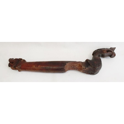 208 - Carved hardwood boat tiller, probably 18th century, the long wooden tiller carved with a griffin mas... 