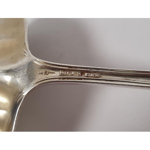 271 - International sterling silver ladle, two matching spoons and a sterling ladle with engraved decorati... 