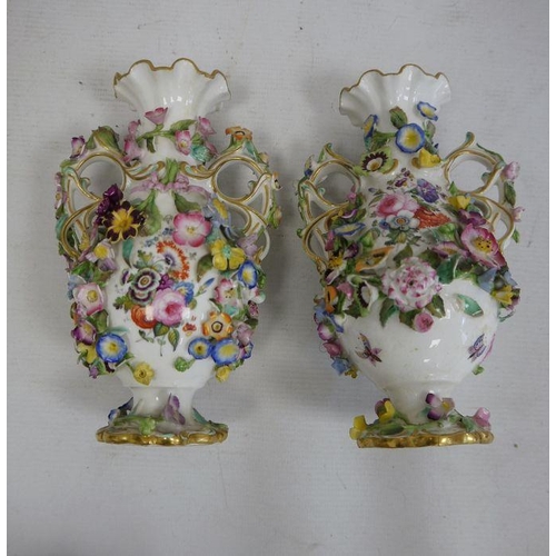 36 - Pair of 19th century china floral encrusted vases, baluster-shaped with scrolled and looped handled,... 